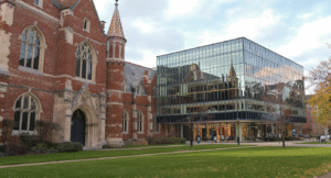 Traditional Oxford Cambridge university building contrasted with modern glass business school architecture representing UK management education evolution